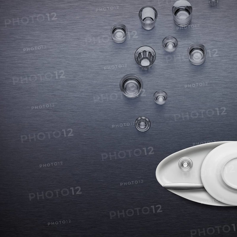 Creative dishware concept, figure of a fish blowing bubbles made of plates and glasses