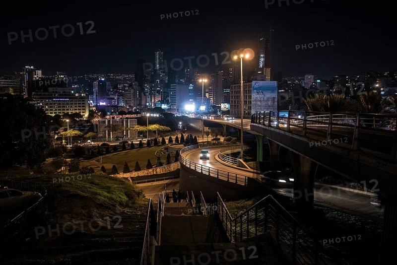 Cars drive at night on the Beirut Central Ring Road, one of the most important transport links in the capital of Lebanon. The photo shows the section of Fouad Chehab Avenue and the city skyline