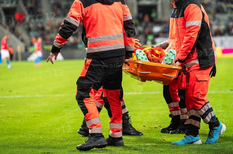 The injured footballer on the strecher