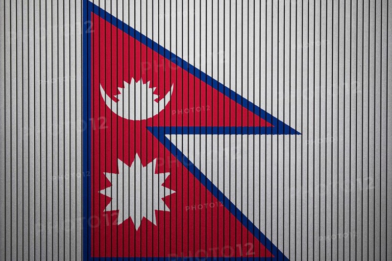 Nepal Flag painted on the cracked grunge concrete wall