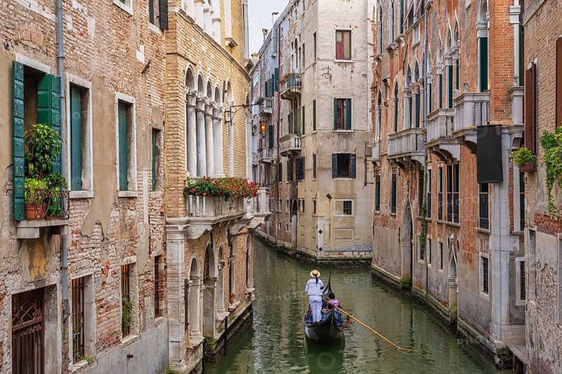 Venice Italy, city skyline at canal in Venice with Gondola boat