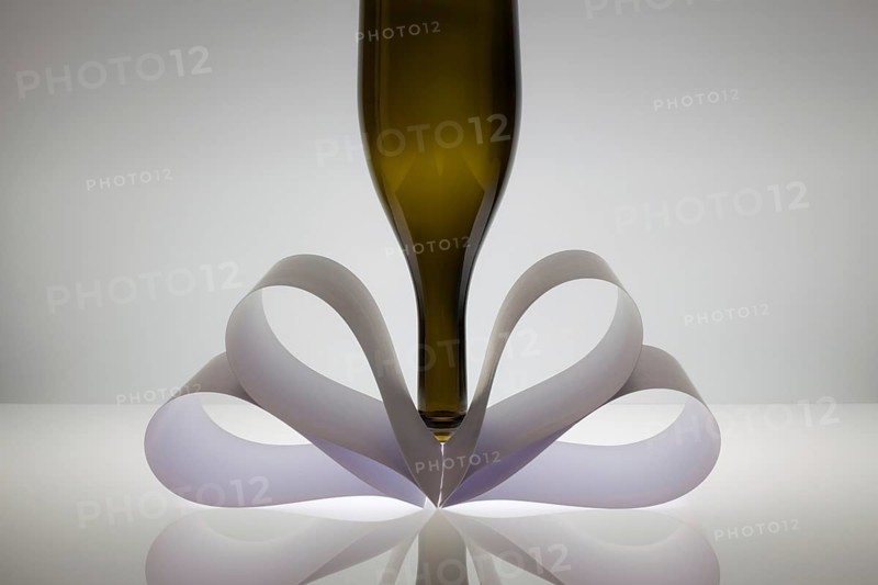 Symmetry abstract Paper Background with wine glass on a glass table