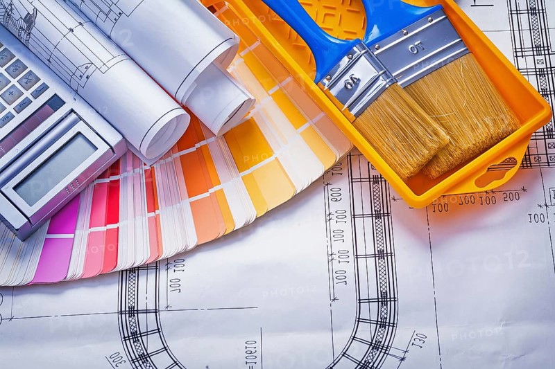 Paintbrushes paint can blueprints calculator color palette construction concept
