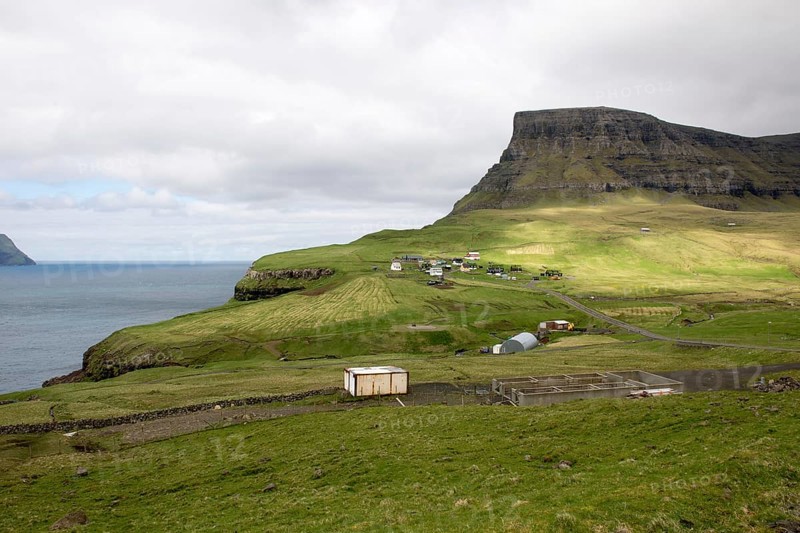 Gasadalur on the Faroe Islands as seen from the street leading towards the village on Vagar, Gasadalur, Faroe Islands, Denmark
