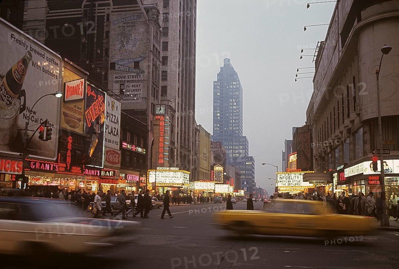 USA New York 1967. Broadway in the evening with cars and people visible and signs on all the buildings. Kodachrome slide original. Credit Roland Palm ref 6-10-20