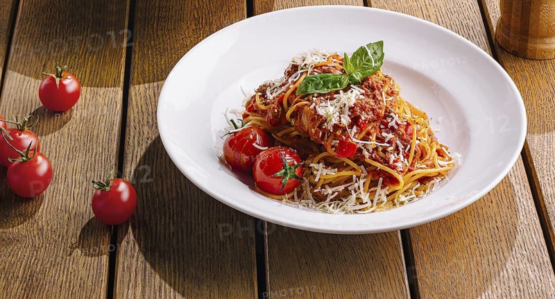 Food, Pasta dish beautifully presented on a warm, wood table setting, evoking a cozy italian dining atmosphere