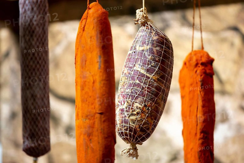 Dried green, brown and orange beef and pork jerky is shown at a food and drink exhibition
