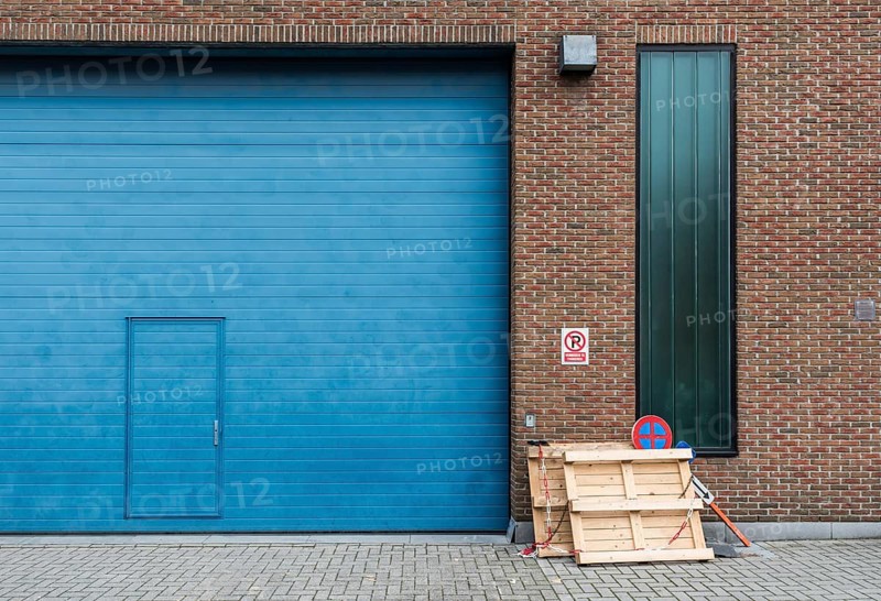 Jette, Brussels Capital Region, Belgium, 12 20 2019 Ugly blue Industrial garage port