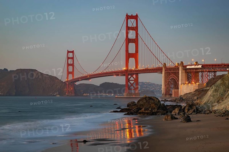 A picture of the Golden Gate Bridge and Baker Beach at sunset