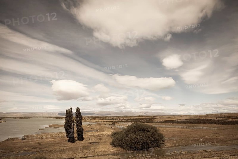 Argentine Patagonia on a windy day. Yellow flat desert with shallow lakes