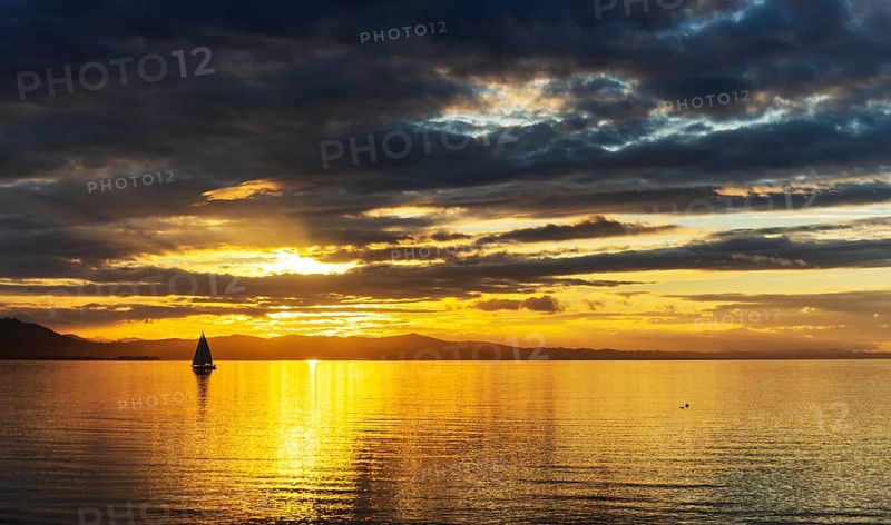 A Saisling Boat in Sunset at the City Lindau at the Lake Constance, Bavaria, Germany