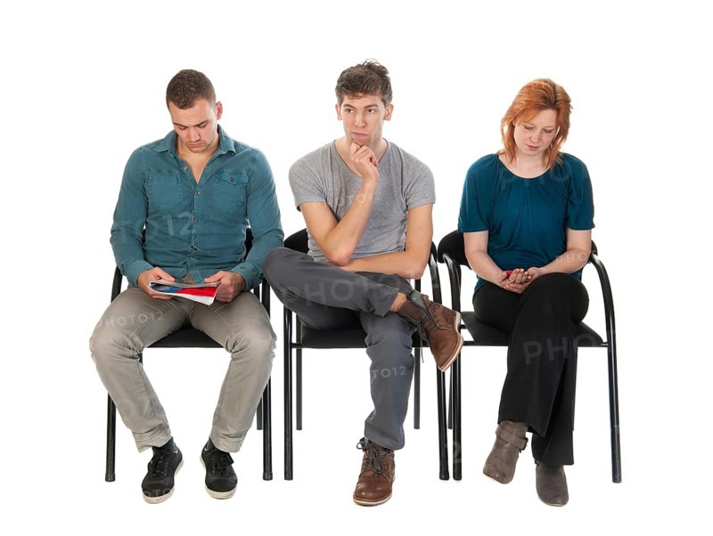 Young people are waiting in a room