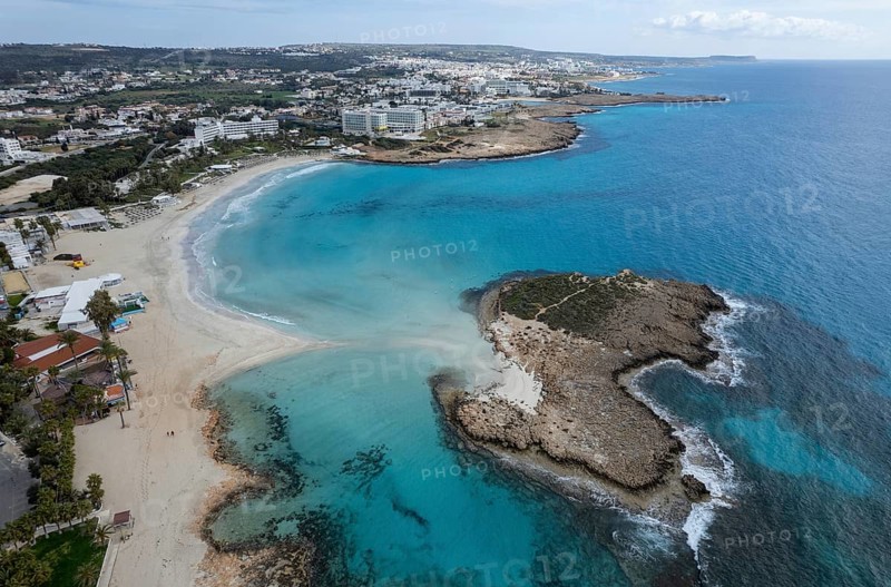Aerial drone view of the coastline of empty beach in winter. Summer holidays. Nissi beach bay Ayia Napa, Cyprus