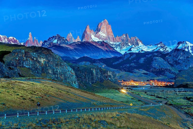 Early morning in the village of El-Chalten. Mountain peak in Patagonia. The grand crimson dawn over the mountain range Fitzroy. The concept of extreme, active and photo tourism