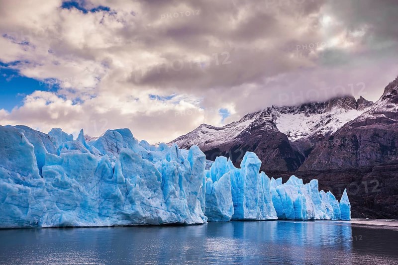 Giant icebergs and ice floes broken away from the shore of the glacier. Grey Lake in the national park Torres del Paine, Chile