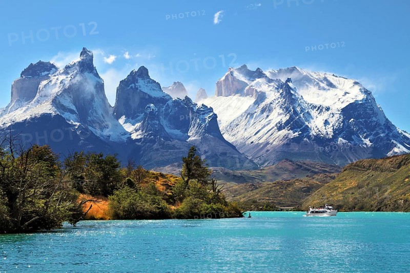 National Park Torres del Paine, Chile. Azure Lake Pehoe at the foot of the magnificent snow-covered cliffs of Los Kuernos