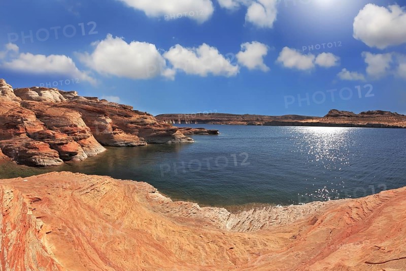 Photo taken fisheye lens. Midday heat. The artificial Lake Powell in the red desert of California