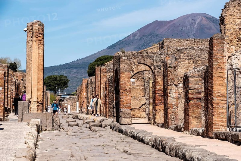 POMPEII, ITALY, MAY 04, 2022, Scenic view of ancient Pompeii, the Vesuvius volcano threatening in the background, Southern Italy