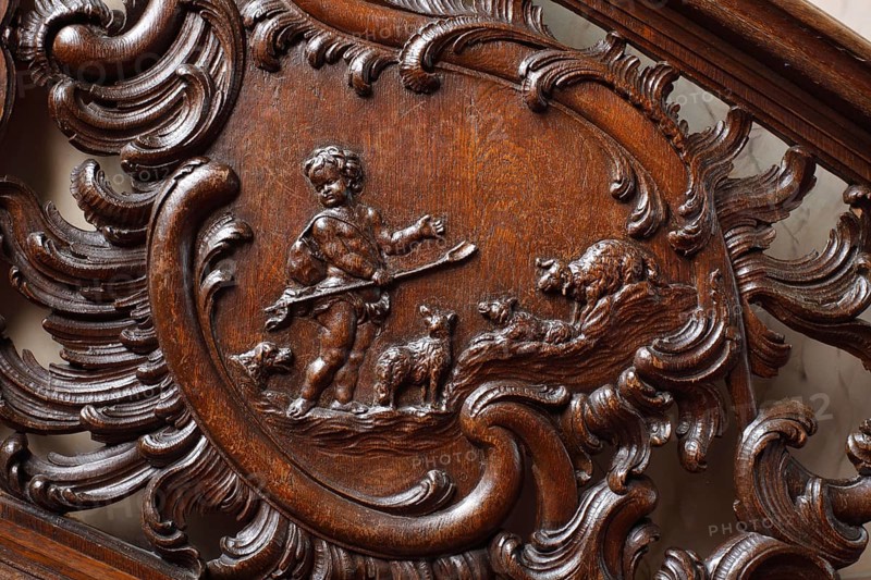 Residential house Zum goldenen Helm, cantilevered oak staircase, balustrade with cartouches. Depictions of putti at the drapery: The wool (shepherd and sheep)
