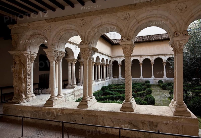 Aix en Provence, cloister of the cathedral. Romanesque cloister partial view left corner pillar with relief of St Peter, St, Saint, Saint