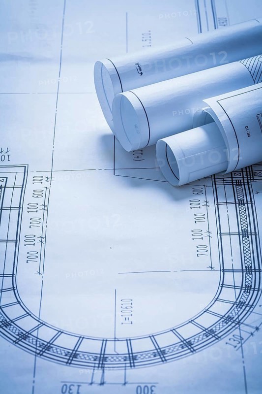 Rolled up construction plans building and architecture concept