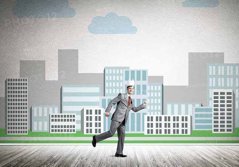 King businessman in elegant suit running and cityscape silhouette at background