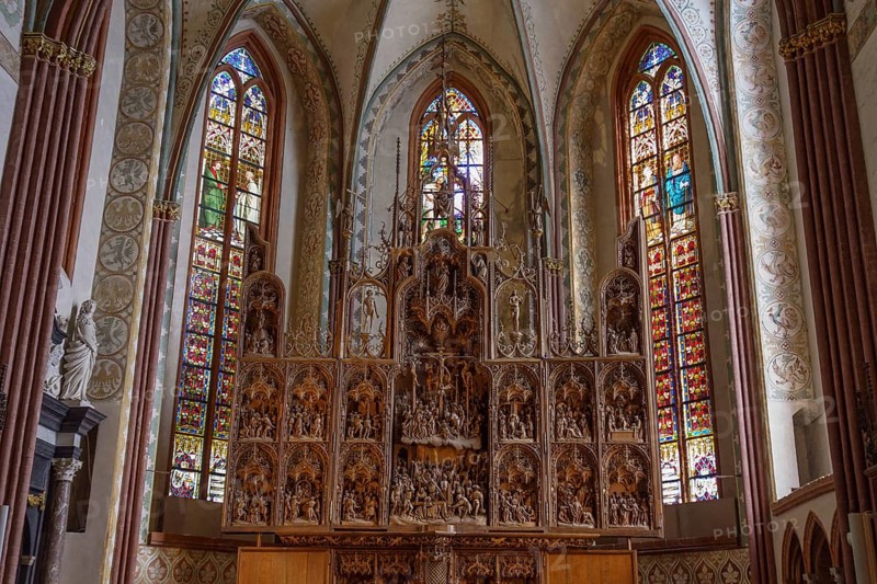 Detailed altarpiece with colourful church windows in Gothic style, schleswig, germany