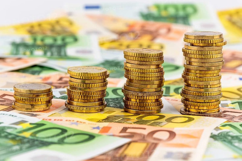 Stack of coins, rising curve, symbolic photo for rising profits and also rising costs Austria
