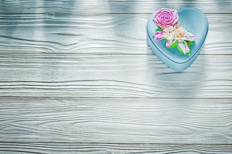 Metal present box on wooden board holidays concept
