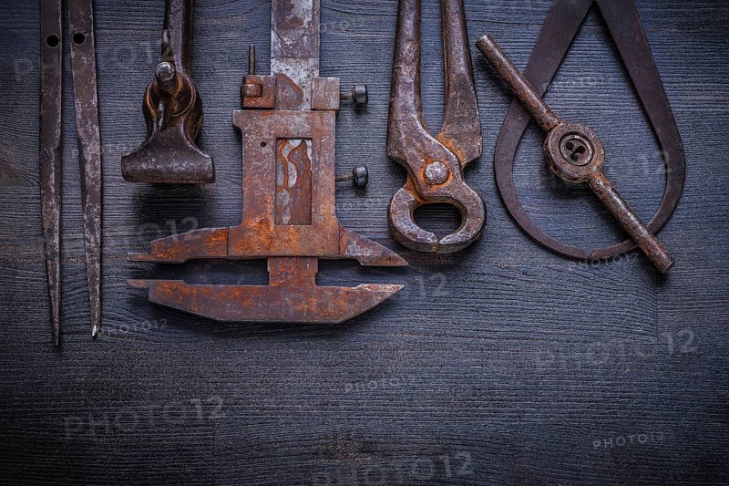 Set of old tools on vintage board