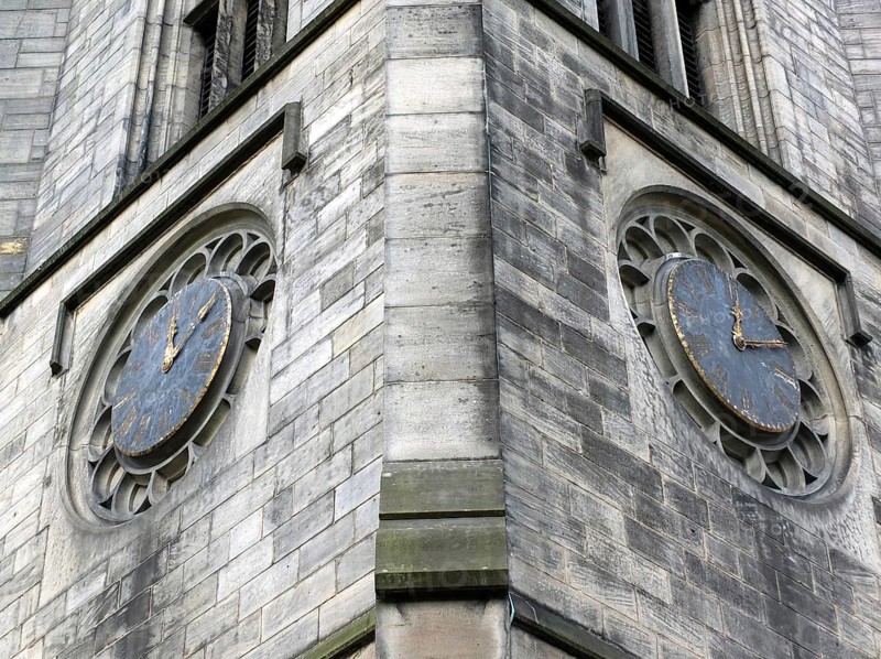 The tower of church of saint johns in leeds a seventeenth century church showing two old clocks