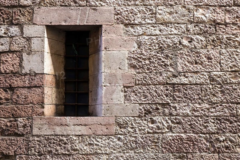 Assisi Italy : Window on medieval stone wall