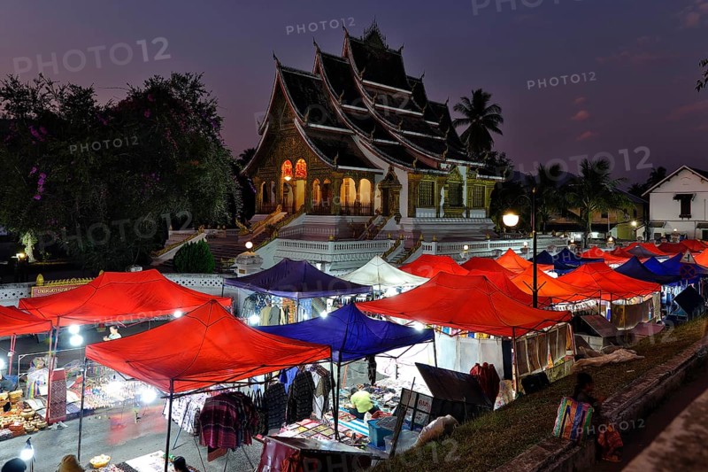 Night market in front of the Buddhist temple Haw Phra Bang of the Royal Palace, National Museum on Sisavangvong Road, Luang Prabang, Laos