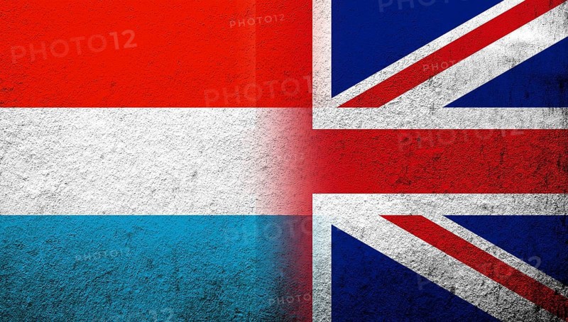 National flag of United Kingdom (Great Britain) Union Jack with Luxembourg National flag. Grunge background