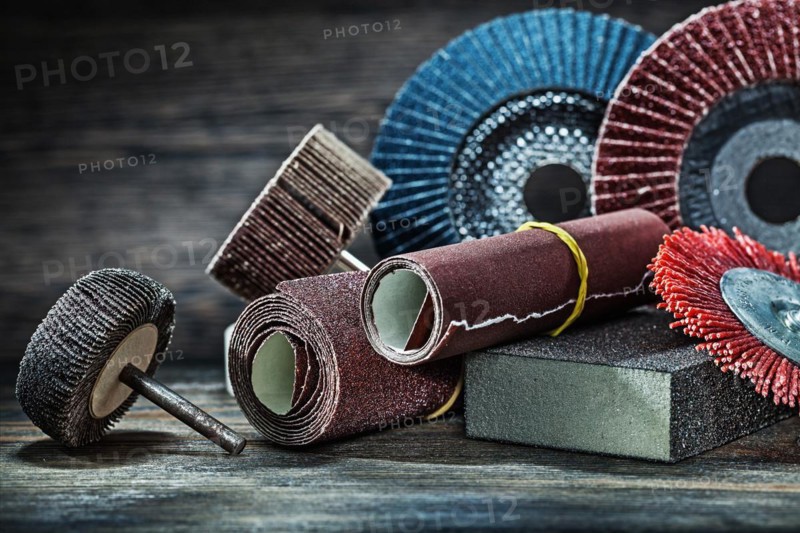 Big set of abrasive tools on vintage wood