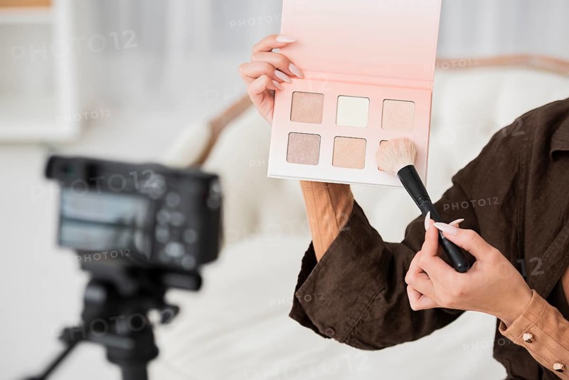 Close up woman holding make up colors