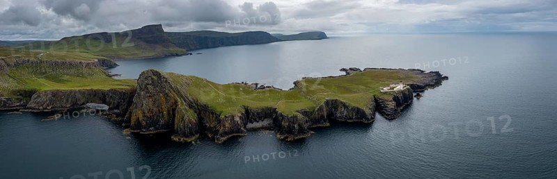 A panorama drone view of the Neist Point Lighthouse and the Minch on the western coast of Isle of Skye