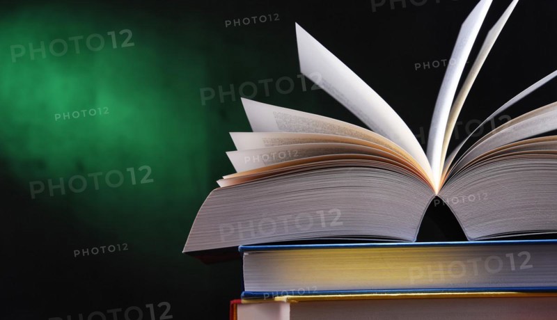 Composition with open book on the table
