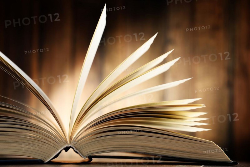 Composition with hardcover book on the table