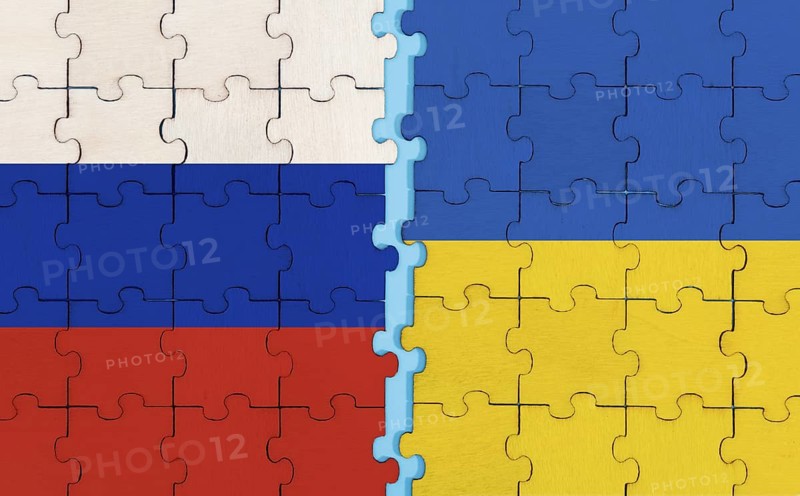 Russia and Ukraine flag on puzzle background