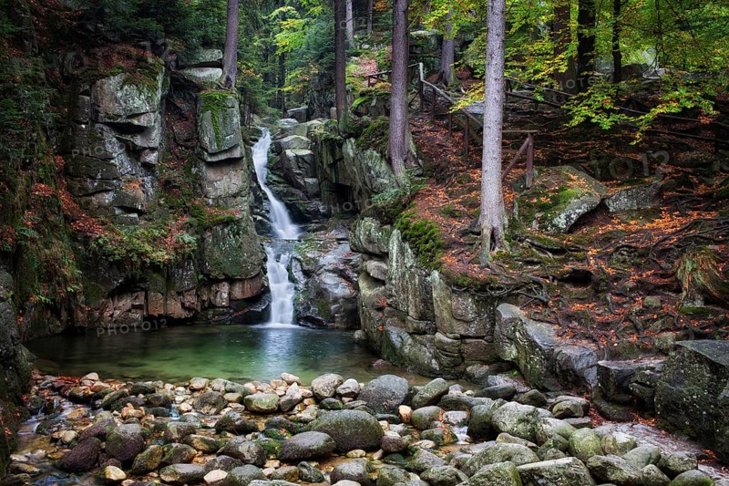 Waterfall in autumn forest of Karkonosze Mountains, Przesieka, Poland