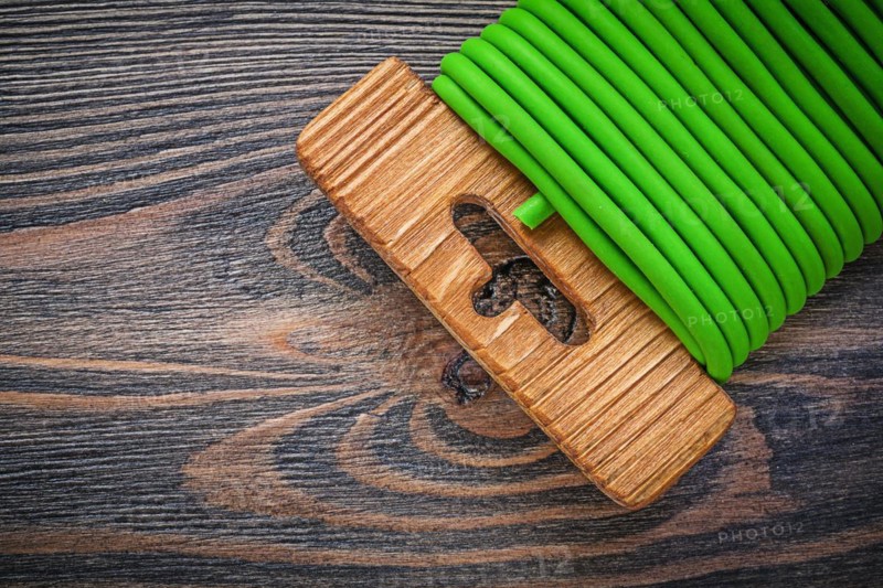 Garden tie wire on wooden board gardening concept