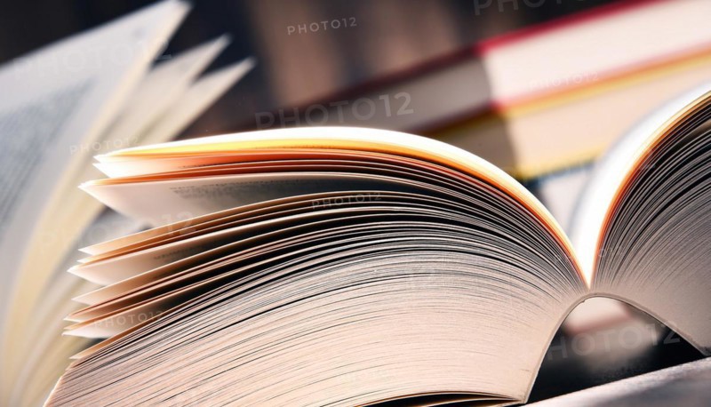 Composition with open book on the table