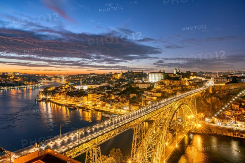 Porto with the Dom Luis I bridge and the Douro river after sunset