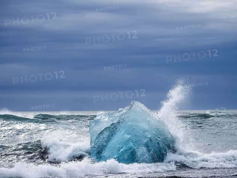 Diamond Beach, iceberg in the surf, near Jökulsarlon glacier lagoon, Vatnajökull National Park, Hornafjörður, South Iceland, Iceland