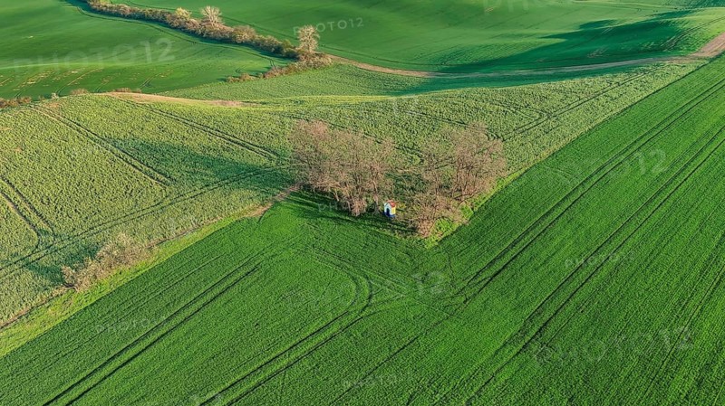 Aerial view of Chapel st. Barbara on South Moravian hill fields during spring time, Moravia, Czech Republic