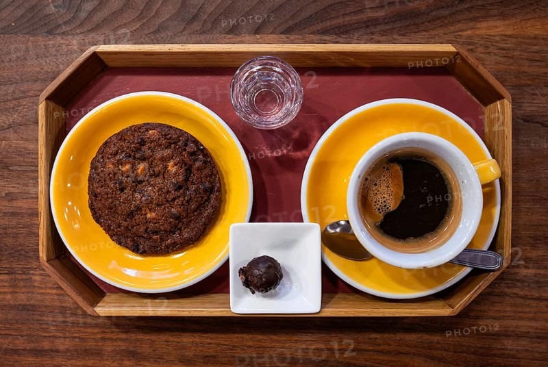 Plate with American style chocolate cookie, a coffee and a luxury chocolate, Brussels, Belgium