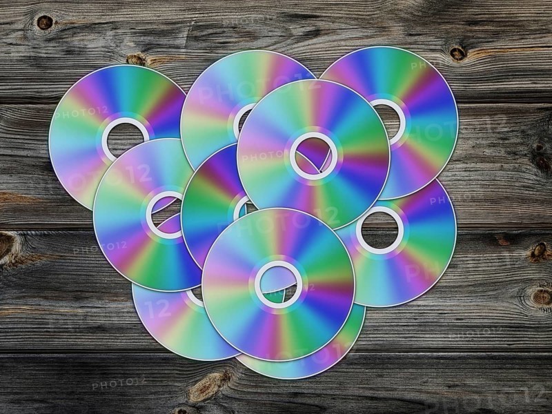 Cd disks over the wooden background