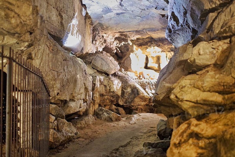 A stalactite cave with a path in the middle