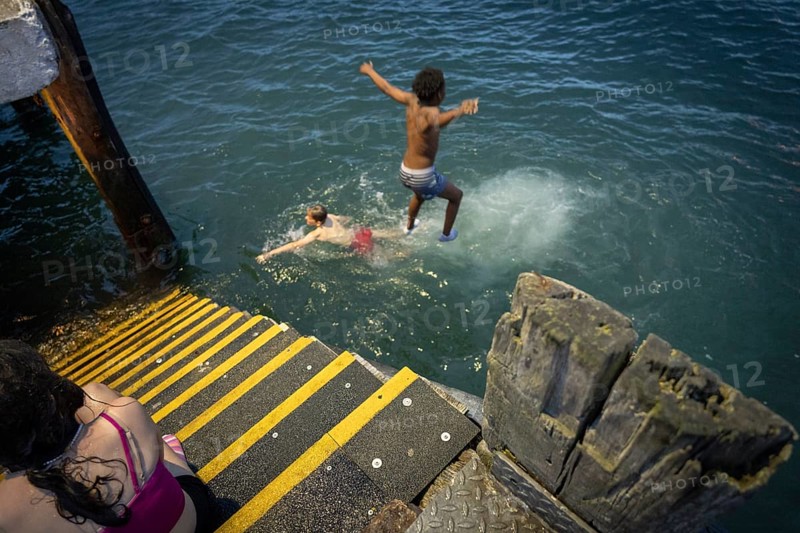 Children jumping into the sea, Cobh, Harbor of Cork, County Cork, Ireland, United Kingdom